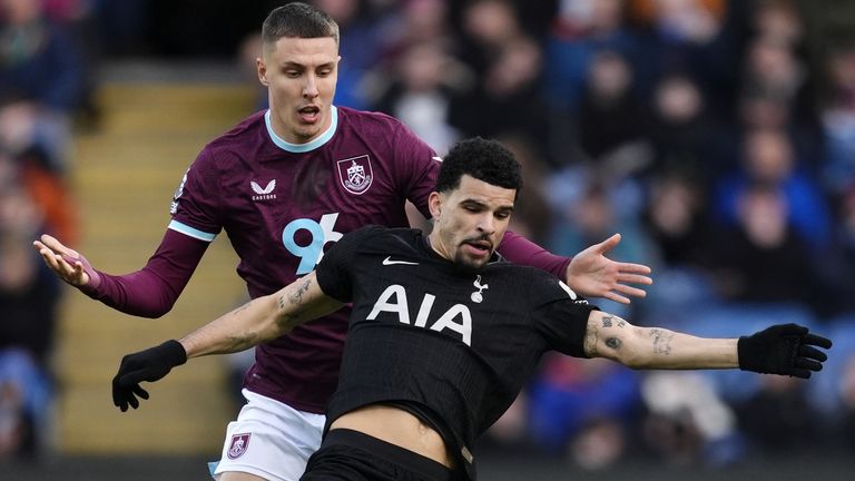 Maxime Esteve and Dominic Solanke battle for the ball