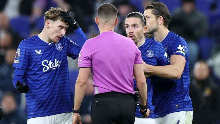 Jack Grealish protests after being shown a red card by referee Thomas Kirk