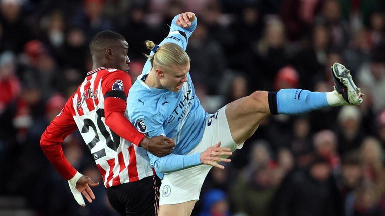 Nordi Mukiele tangles with Erling Haaland