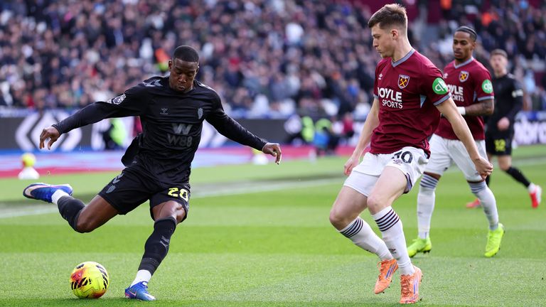 Nordi Mukiele  is challenged by Oliver Scarles