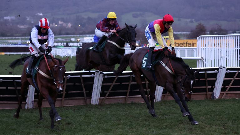The runners jump the last in the AIS Novices' Hurdle