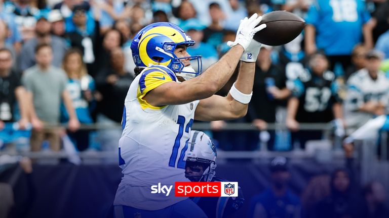 Los Angeles Rams wide receiver Puka Nacua (12) makes a touchdown catch past Carolina Panthers safety Nick Scott (21) during the first half of an NFL divisional playoff football game, Saturday, Jan. 10, 2026, in Charlotte, N.C.