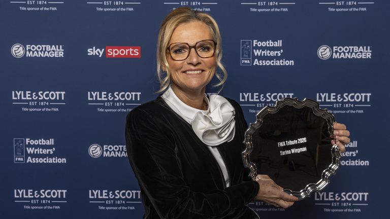 England women head coach Sarina Wiegman poses with her FWA Tribute award