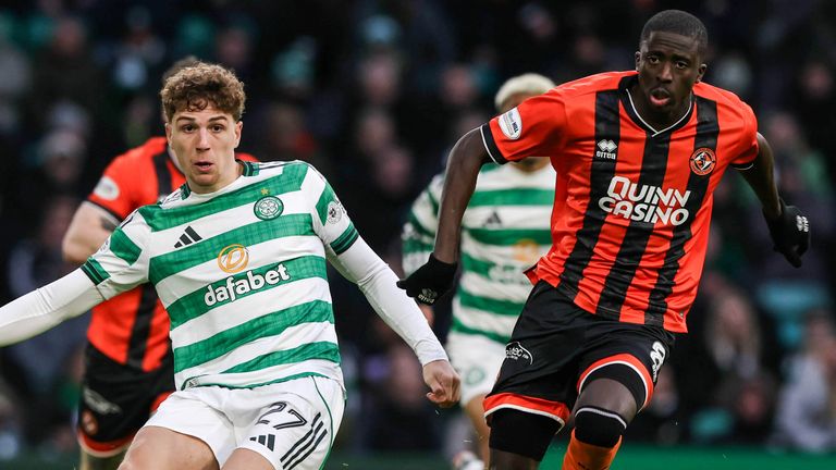 Arne Engels passes the ball under pressure from Panutche Camara