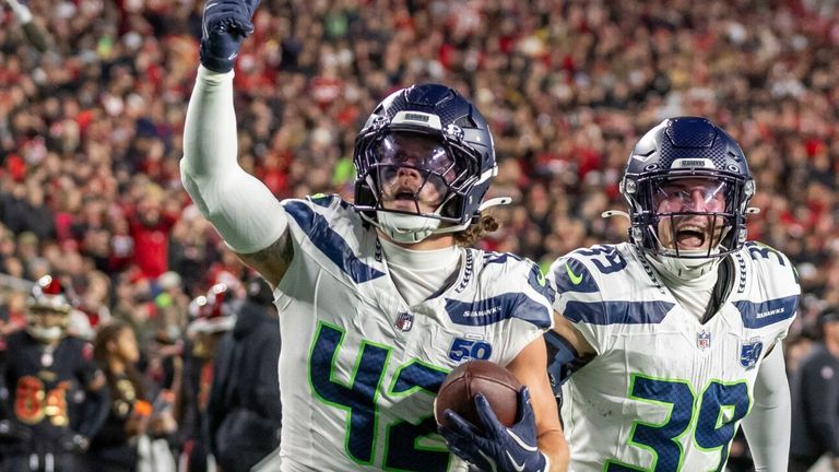 Seattle Seahawks linebacker Drake Thomas (42) celebrates with team-mates after intercepting a pass (AP Photo/Jeff Lewis)