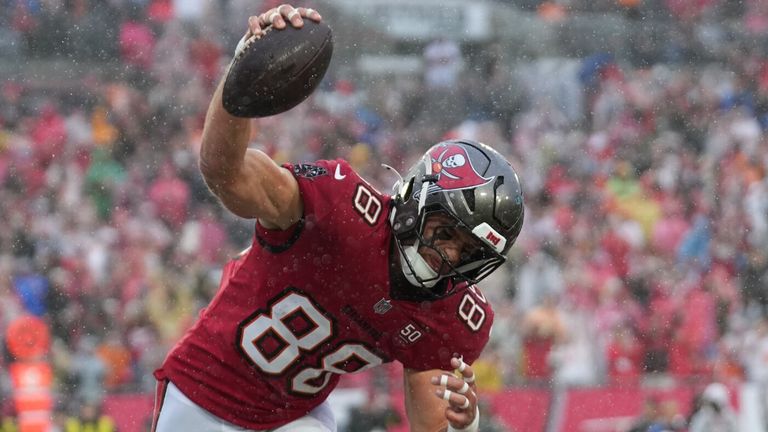 Tampa Bay Buccaneers tight end Cade Otton (88) spikes the ball after a touchdown catch (AP Photo/Peter Joneleit)