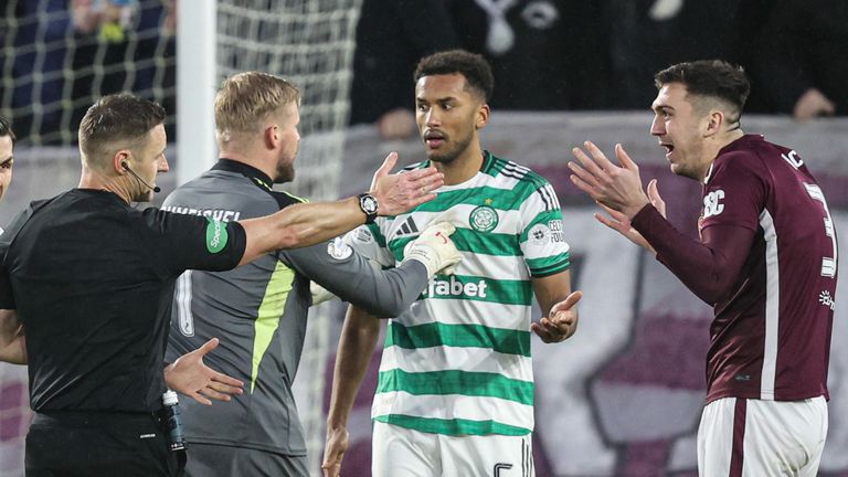 EDINBURGH, SCOTLAND - JANUARY 25: Referee Steven McLean initially awards a yellow card to Auston Trusty before VAR confirm the denial of a goal scoring opportunity which ends up being a red card during a William Hill Premiership match between Heart of Midlothian and Celtic at Tynecastle Park, on January 25, 2026, in Edinburgh, Scotland. (Photo by Ross Parker / SNS Group)