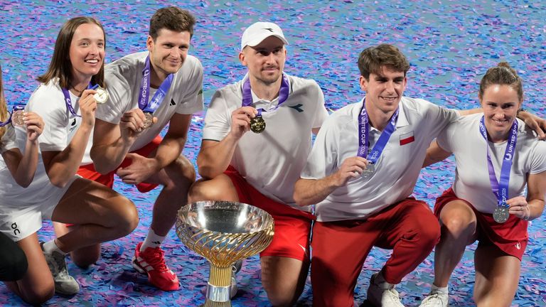 Poland celebrate with the trophy after winning the 2026 United Cup in Sydney (Associated Press)