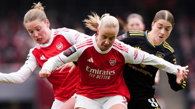 Kim Little and Beth Mead battle with Manchester United's Jess Park