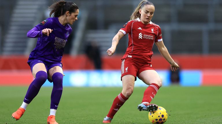 Lily Woodham controls the ball under pressure from Freya Godfrey 