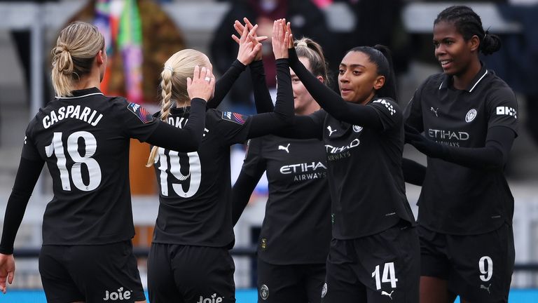 Kerolin is congratulated by her team-mates after giving Manchester City the lead against London City Lionesses