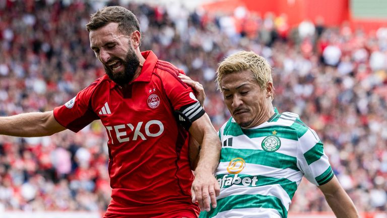 ABERDEEN, SCOTLAND - AUGUST 10: Celtic's Daizen Maeda (R) and Aberdeen's Graeme Shinnie in action during a William Hill Premiership match between Aberdeen and Celtic at Pittodrie, on August 10, 2025, in Aberdeen, Scotland. (Photo by Craig Foy / SNS Group)