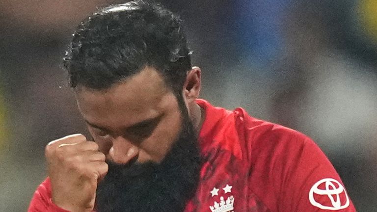 England's Adil Rashid celebrates the wicket of West Indies' Rovman Powell during the T20 World Cup cricket match between England and West Indies in Mumbai, India, Wednesday, Feb. 11, 2026. (AP Photo/Rafiq Maqbool)