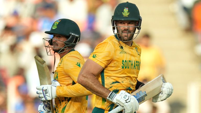 South Africa's captain Aiden Markram, right, and batting partner Quinton de Kock run between the wickets during the T20 World Cup cricket match between South Africa and West Indies in Ahmedabad, India, Thursday, Feb. 26, 2026. (AP Photo/Ajit Solanki)