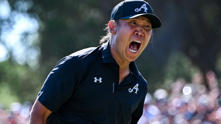 Anthony Kim roars in celebration after sinking his winning putt