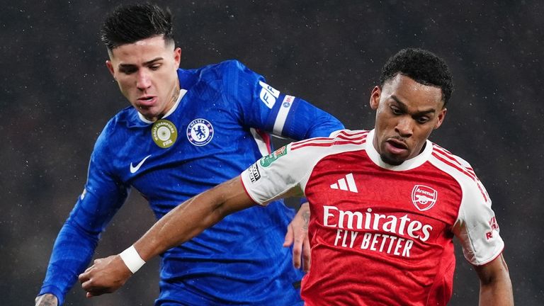 Arsenal's Jurrien Timber and Chelsea's Enzo Fernandez battle for the ball