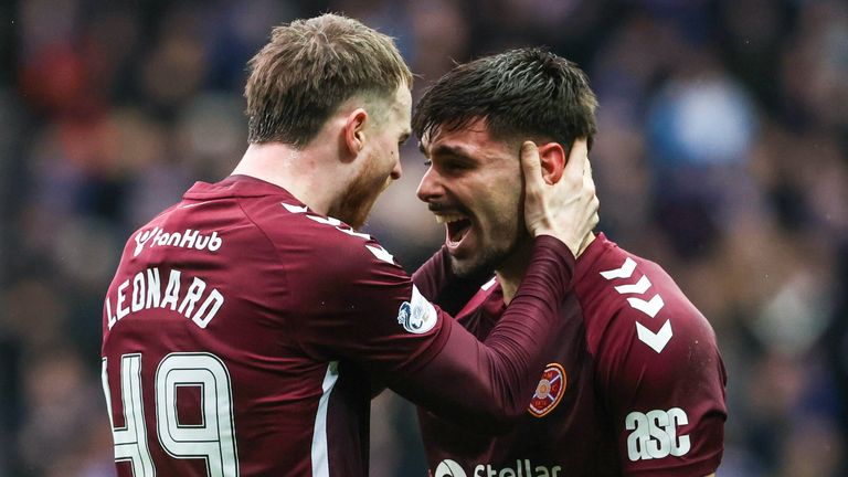 Hearts' Claudio Braga (R) celebrates scoring to make it 2-1 with Marc Leonard 