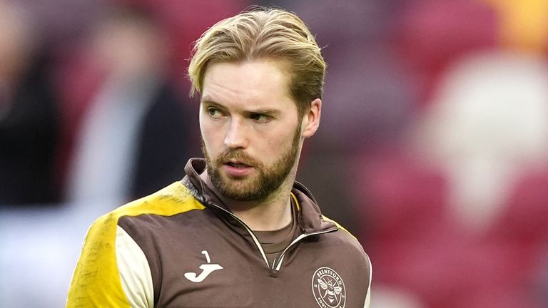 Brentford goalkeeper Caoimhin Kelleher warming up prior to kick-off before the Premier League match at the Gtech Community Stadium, London. 