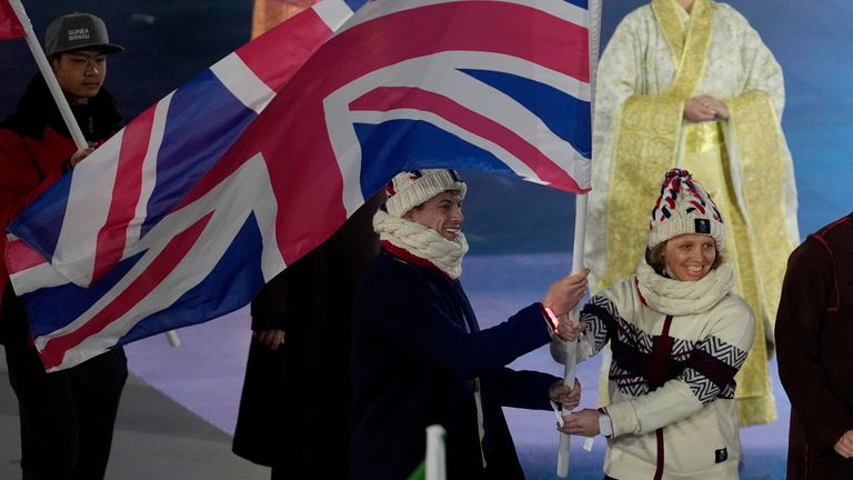 Britain's Charlotte Bankes and Matt Weston wave the British flag during the closing ceremony of the 2026 Winter Olympics, in Verona, Italy, Sunday, Feb. 22, 2026. (AP Photo/Ashley Landis)