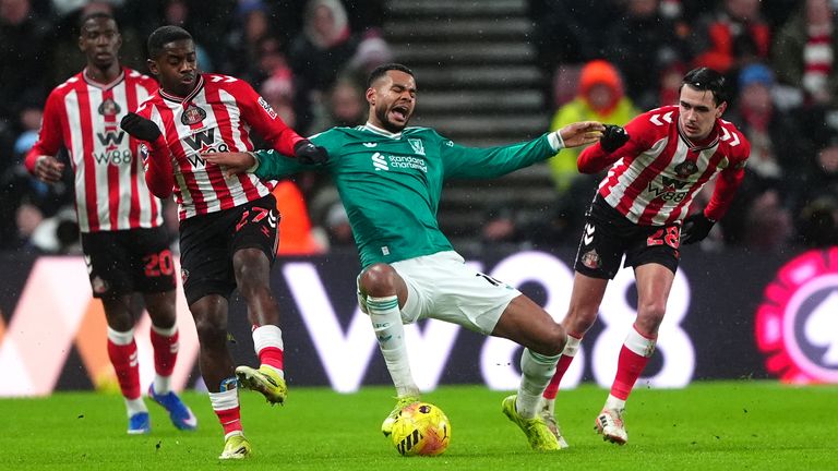 Liverpool's Cody Gakpo (centre) battles with Sunderland's Noah Sadiki (left) and Enzo Le Fee