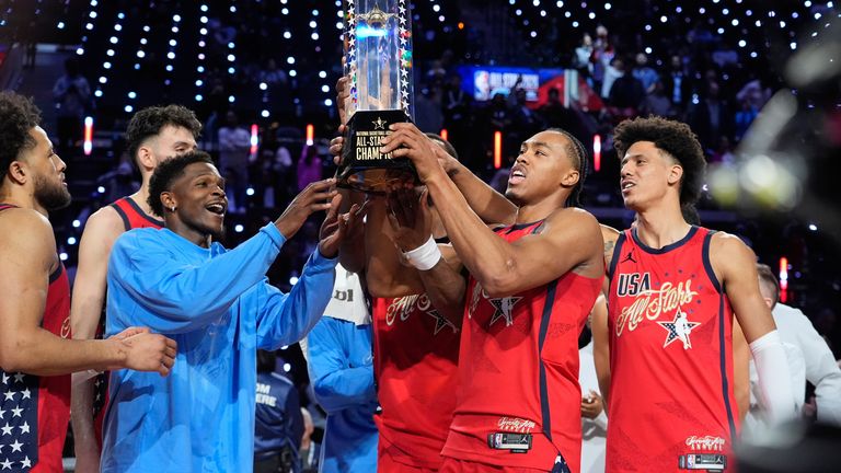 USA Stars lift the championship trophy after their win over USA Stripes in the final 