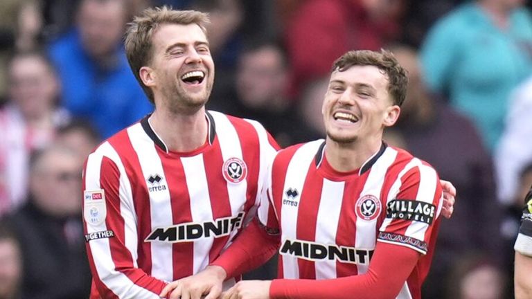 Harrison Burrows celebrates with Patrick Bamford after doubling Sheffield United's lead against Sheffield Wednesday