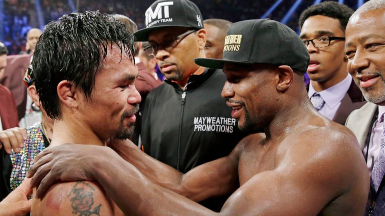 Manny Pacquiao and Floyd Mayweather Jr embrace after their first fight 