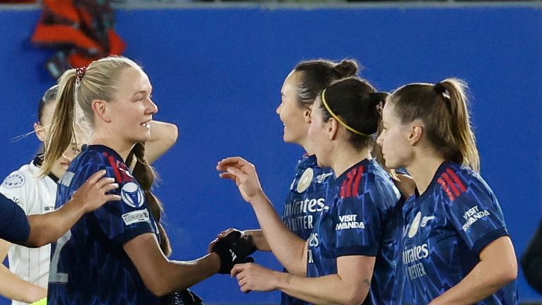 Arsenal players celebrate after Arsenal's Frida Maanum scored the opening goal during the women's Champions League knockout play-off soccer match between OH Leuven and Arsenal in Leuven, Belgium, Wednesday, Feb. 11, 2026. (AP Photo/Geert Vanden Wijngaert)