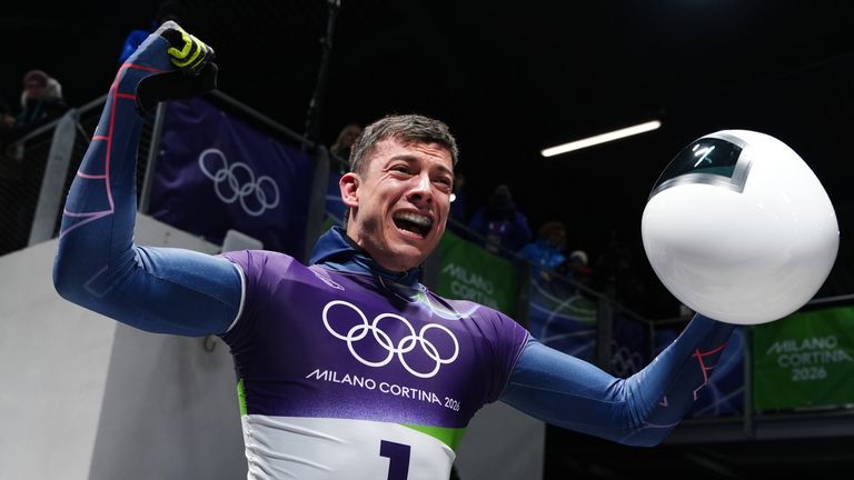 Great Britain's Matt Weston celebrates after winning the gold medal in the men's skeleton