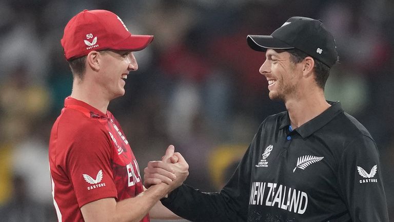 England's captain Harry Brook, left, and New Zealand's captain Mitchel Santner shake hands before the coin toss of the T20 World Cup cricket match between England and New Zealand in Colombo, Sri Lanka, Friday, Feb. 27, 2026. (AP Photo/Eranga Jayawardena)