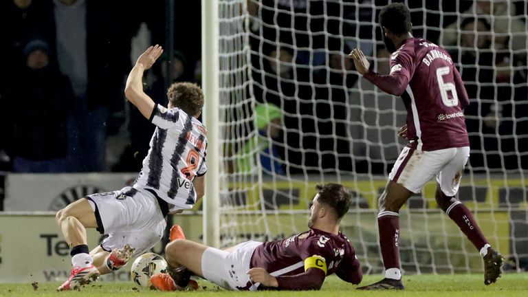 Heart of Midlothian's Craig Halkett brings down St Mirren's Jacob Devaney resulting in a red card
