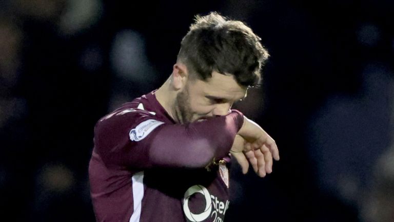 Heart of Midlothian's Craig Halkett walks off the pitch after being sent off at St Mirren