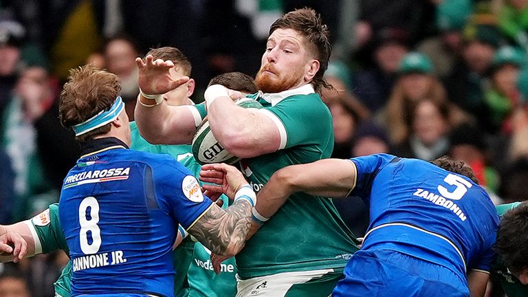 Ireland's Joe McCarthy (centre) is tackled by Italy's Lorenzo Cannone (left) and Andrea Zambonin