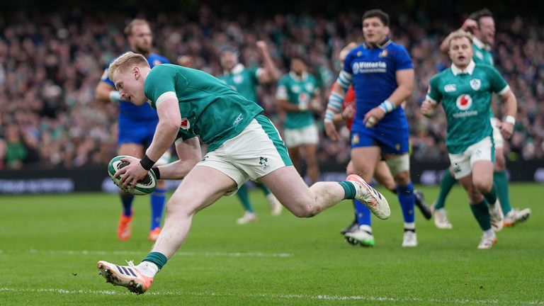 Ireland's Jamie Osborne scores a try to make it 5-3