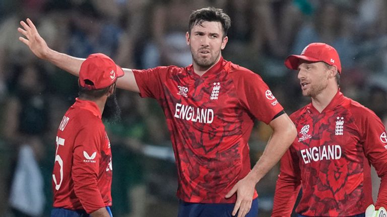 England's Jamie Overton, centre, celebrates with teammates the wicket of Pakistan's Babar Azam during the T20 World Cup cricket match between England and Pakistan in Pallekele, Sri Lanka, Tuesday, Feb. 24, 2026. (AP Photo/Eranga Jayawardena)