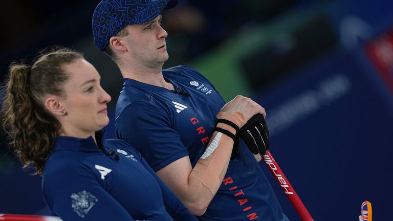 Britain's Jennifer Dodds and Bruce Mouat competes against Italy during the bronze medal mixed doubles curling match, at the 2026 Winter Olympics, in Cortina D'Ampezzo, Italy, Tuesday, Feb. 10, 2026. (AP Photo/Fatima Shbair)