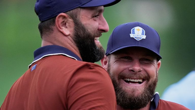 Europe's Tyrrell Hatton, right, and Jon Rahm celebrate after their match at Bethpage Black golf course during the Ryder Cup golf tournament, Saturday, Sept. 27, 2025, in Farmingdale, N.Y. (AP Photo/Robert Bukaty)