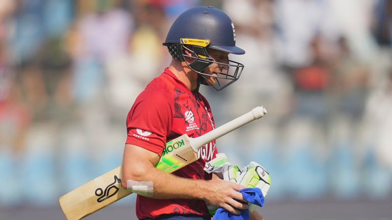 England's Jos Buttler leaves the ground after losing his wicket during the T20 World Cup cricket match between England and Nepal in Mumbai, India, Sunday, Feb. 8, 2026.(AP Photo/Rafiq Maqbool)