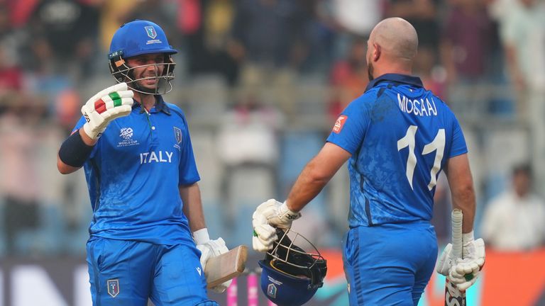 Italy's Justin Mosca, left, Anthony Mosca celebrates after they won the T20 World Cup cricket match against the Nepal in Mumbai, India, Thursday, Feb. 12, 2026. (AP Photo/Rafiq Maqbool)