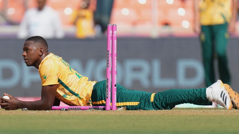 South Africa's Kagiso Rabada looks on with a ball as he run out Afghanistan's Fazalhaq Farooqi during the T20 World Cup cricket match between Afghanistan and South Africa in Ahmedabad, India, Wednesday, Feb. 11, 2026. (AP Photo/Ajit Solanki)