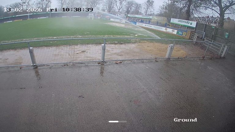 The National League are investigating claims that King's Lynn Town deliberately caused a match to be postponed by watering their pitch during rainfall