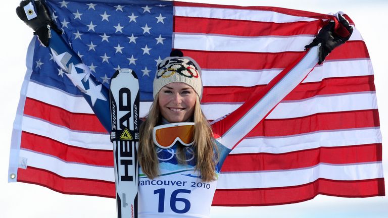 USA's Lindsey Vonn celebrates at the flower ceremony after winning the Ladies Downhill competition at Whistler Creekside, Whistler, Canada