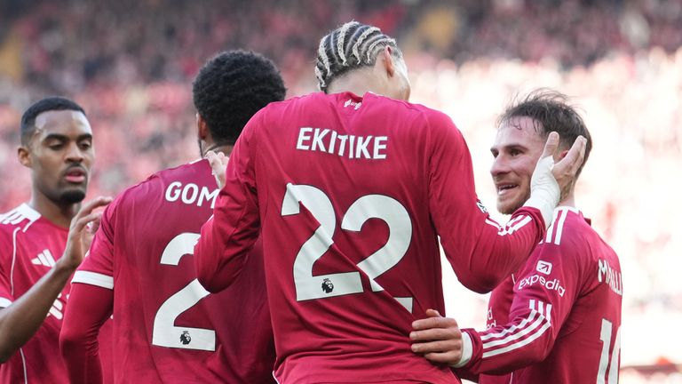 Liverpool players celebrate after scoring their third goal (AP Photo/Jon Super)