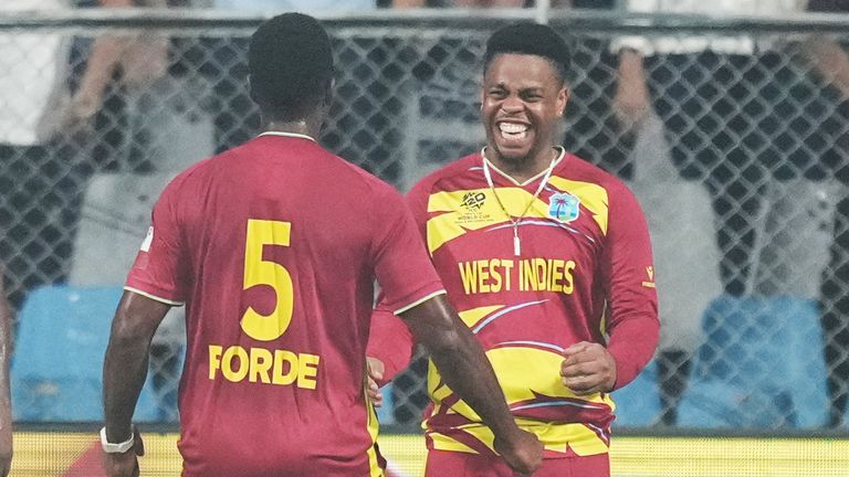 Matthew Forde celebrates with Shimron Hetmyer, during the T20 World Cup cricket match (AP Photo/Rafiq Maqbool)