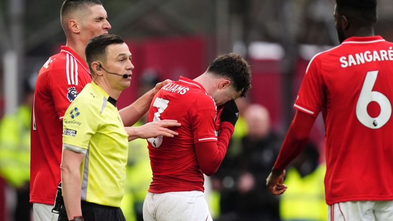 Nottingham Forest's Neco Williams leaves the pitch after being shown a red card for deliberate handball 