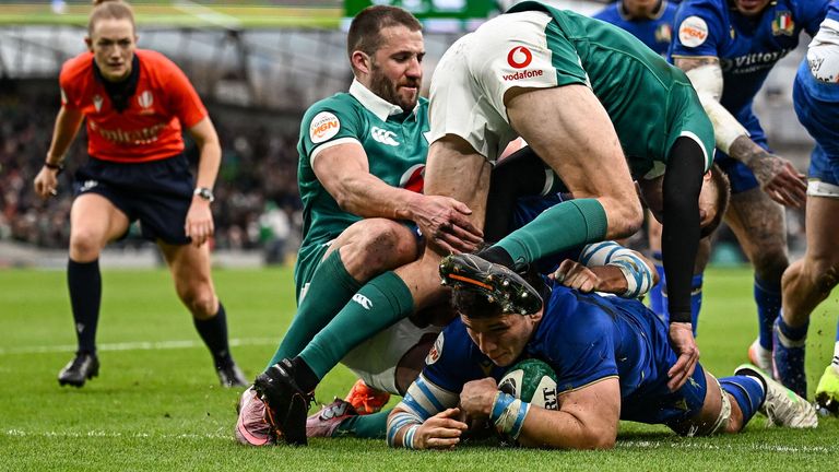 Giacomo Nicotera forced his way past Sam Prendergast for Italy's opening try