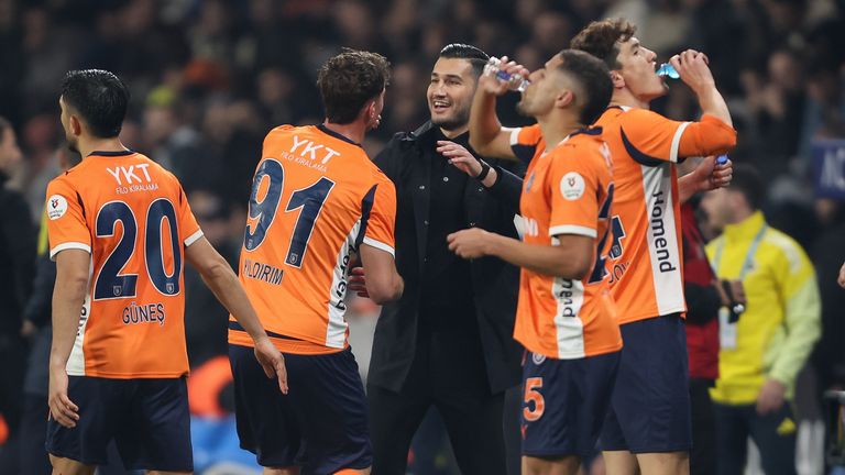 Bertug Yildirim of Basaksehir celebrates with head coach Nuri Sahin