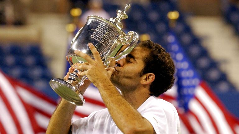 Pete Sampras, of the USA, holds his trophy after his 6-3, 6-4, 5-7, 6-4 win over compatriot Andre Agassi in the men's final at the US Open S
