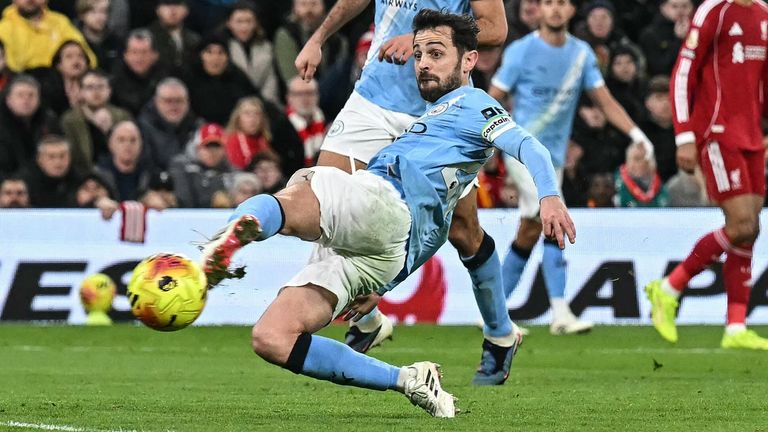 Bernardo Silva slides in to score Man City's equaliser at Anfield