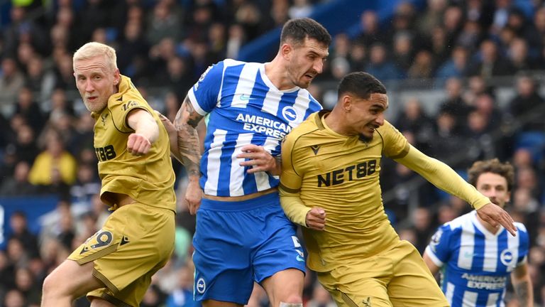Lewis Dunk heads wide under pressure from Will Hughes and Maxence Lacroix 